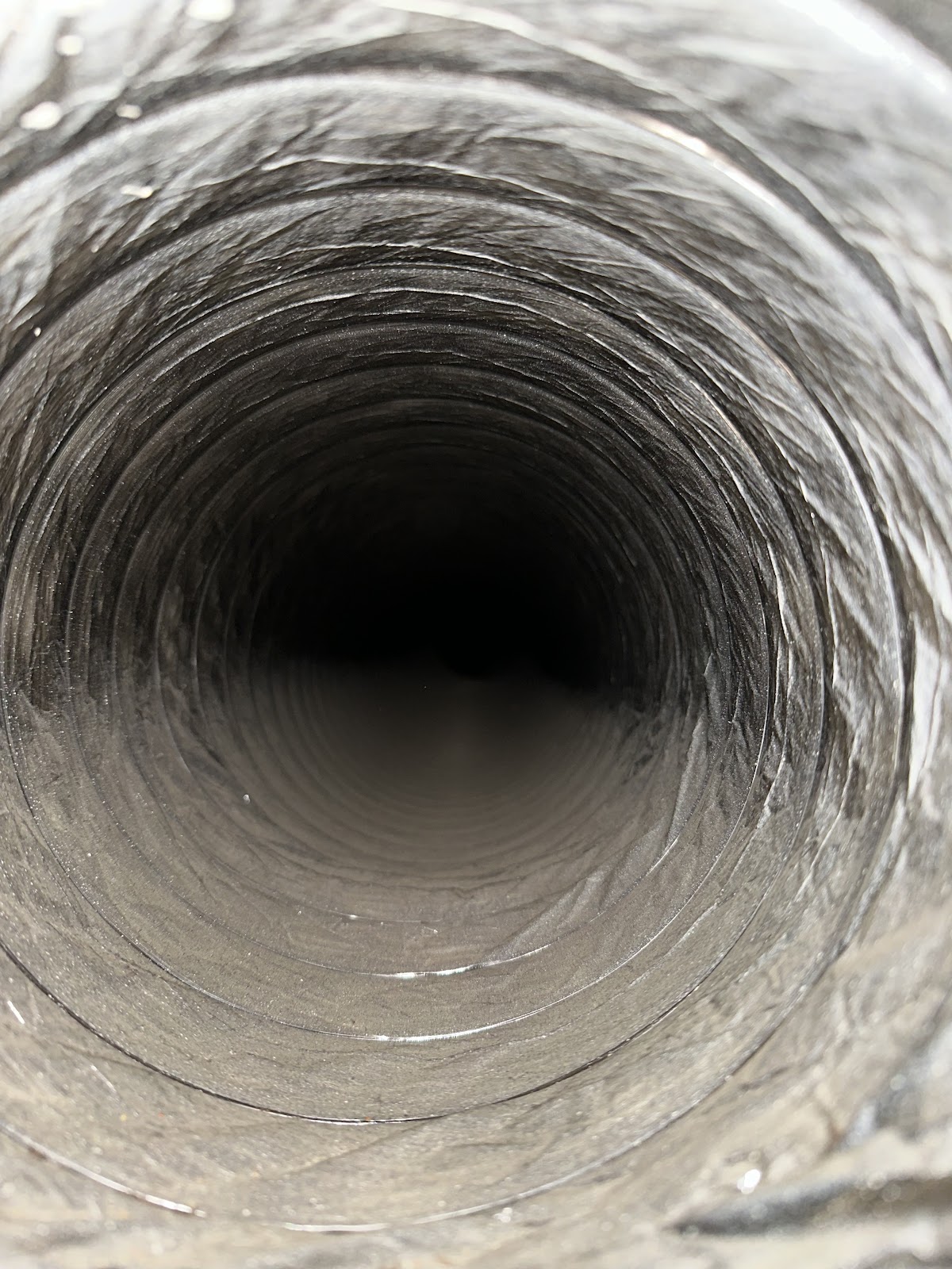 Dark dirty flex duct before service