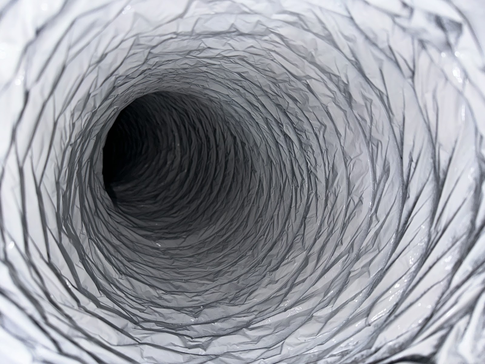 Dirty flex duct interior before cleaning